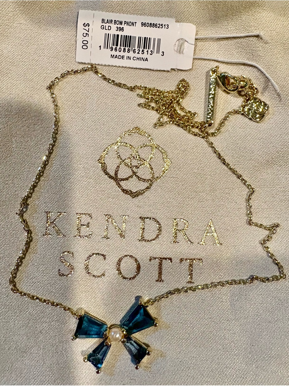 Kendra Scott Gold Necklace with Blue Bow Pendant and Pearl center
